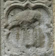 Panel 13:02 - Bird - ? pelican pecking its breast ? (badly eroded)